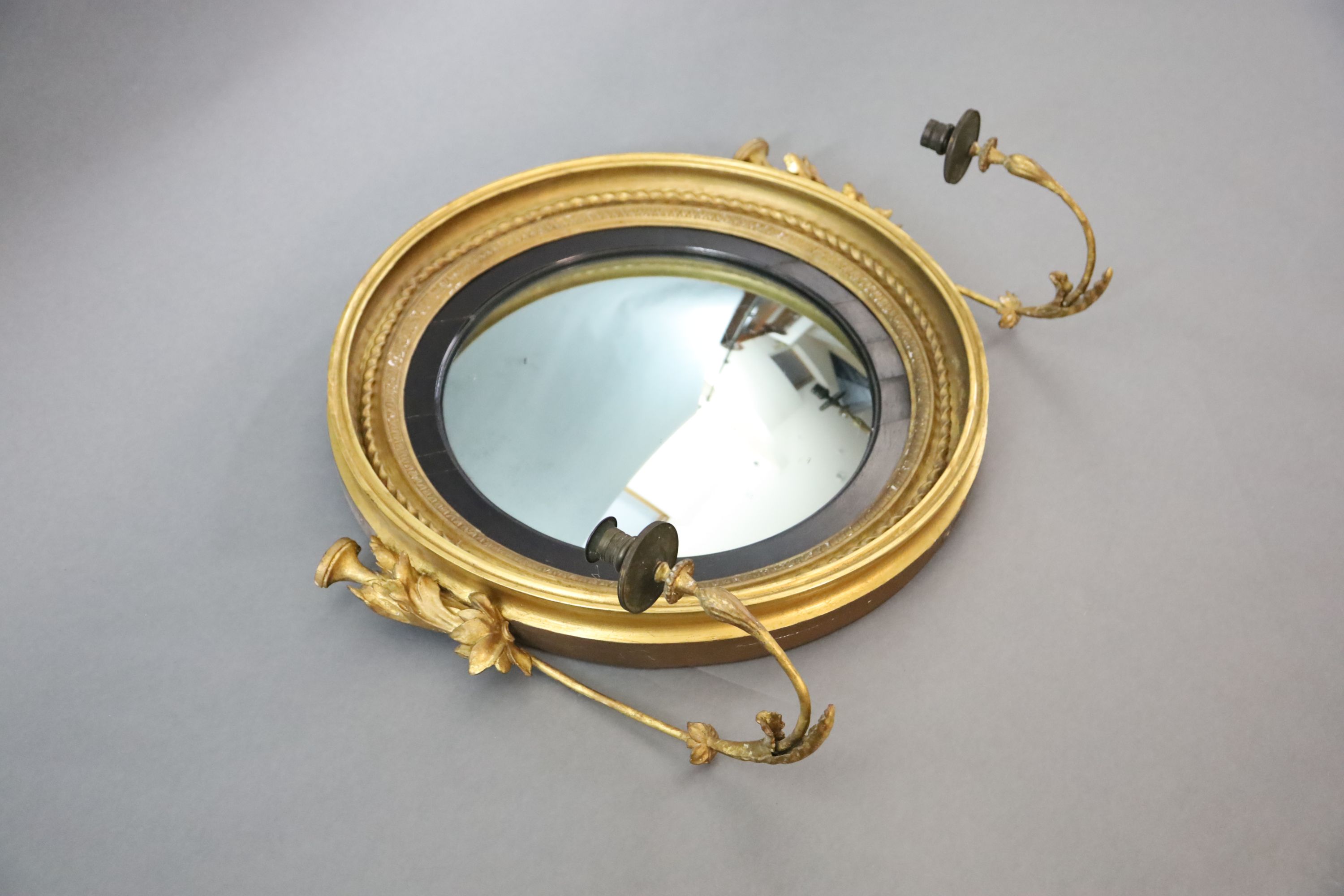 A William IV giltwood and gesso convex girandole, W.2ft 7in. H.2ft 2in.